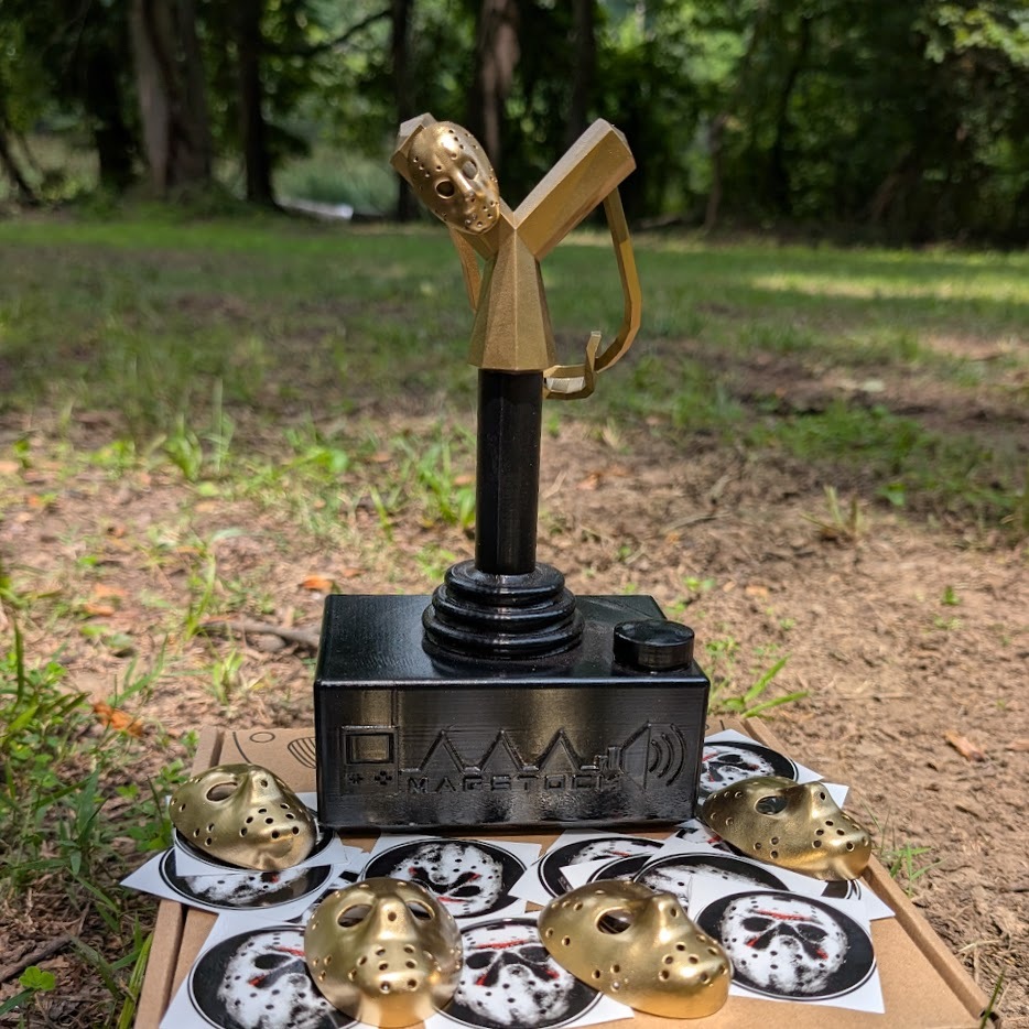 Last year’s slingshot trophy for MAGStock the 13th, complete with tiny masks!